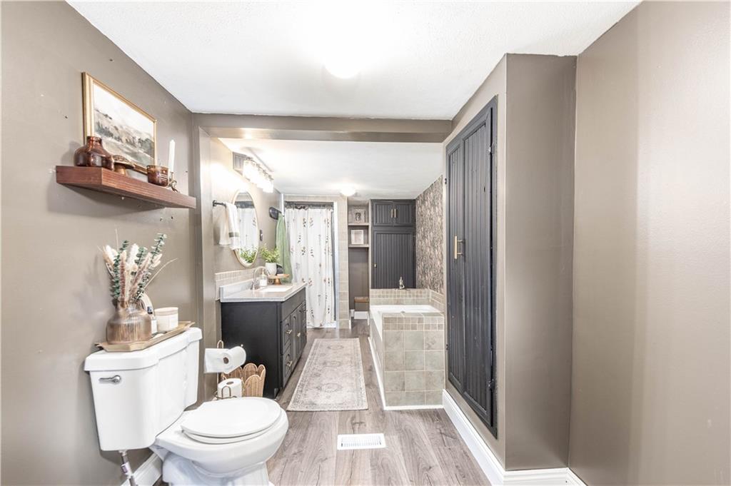 320 Deerfield Road Washington, PA 15301 - Photo 22 of 32 The bathroom has great accent doors, a soaker tub and tiled walk in shower.