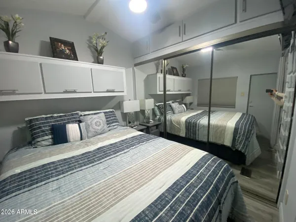 a bedroom with double bed and a closet