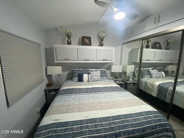 a bedroom with a bed and window