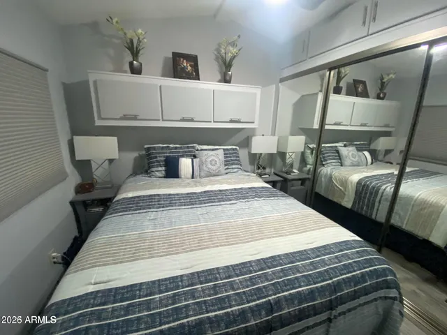 a bedroom with double bed and a window