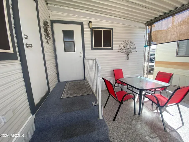 a view of an outdoor dining space with furniture
