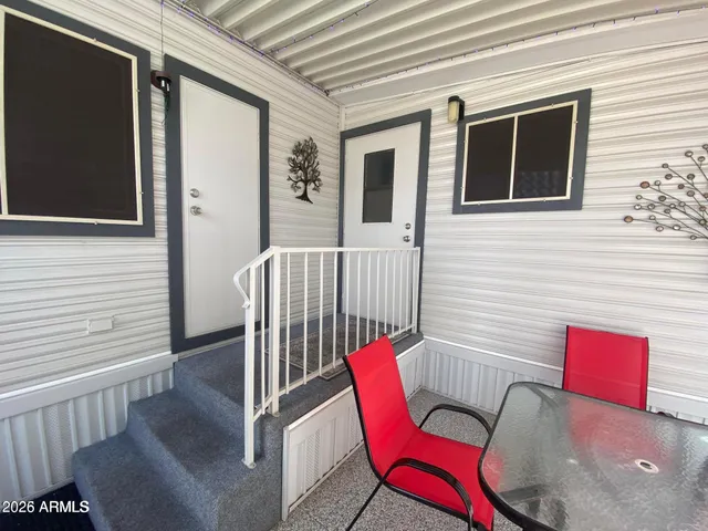 a view of a balcony with furniture
