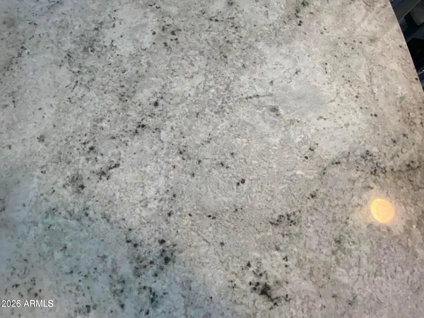 a close up of a white marble wall