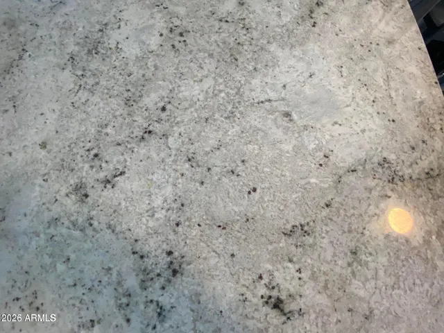 a close up of a white marble wall