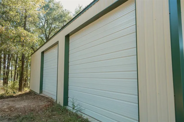 a view of a park with large trees