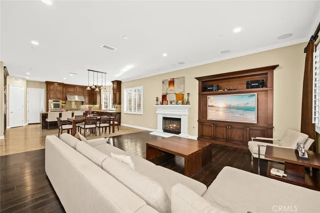 a spacious bedroom with a bed couch and window