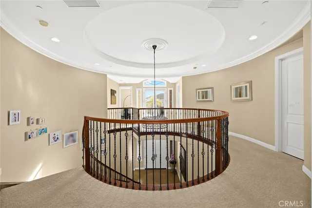 a living room with furniture and a book shelf