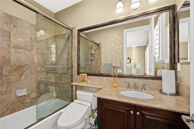 a front view of a house with a yard and fountain