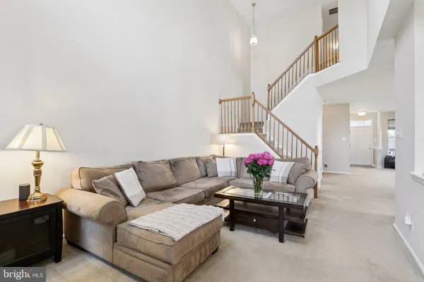 a kitchen with stainless steel appliances granite countertop a stove a sink dishwasher a refrigerator and a microwave