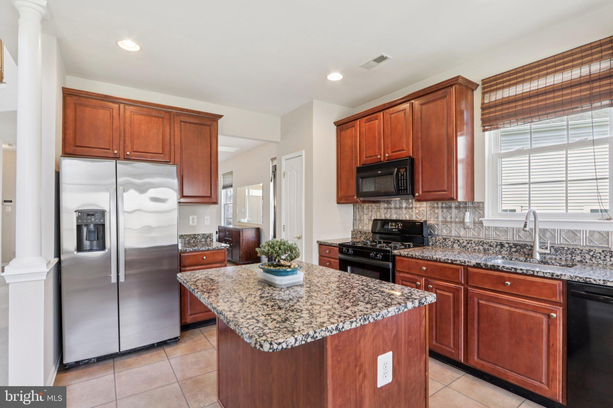 24 Compass Circle Mount Laurel, NJ 08054 - Photo 20 of 61 a kitchen with stainless steel appliances granite countertop a stove a sink dishwasher a refrigerator and a microwave
