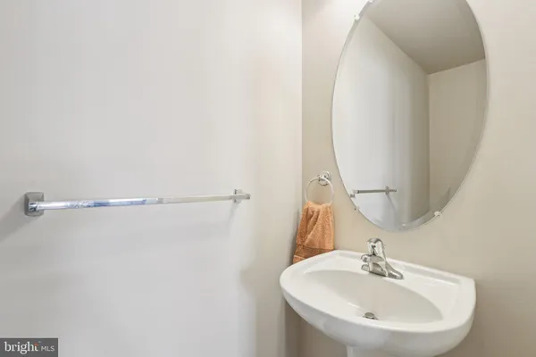 a bedroom with a large bed and a painting on the wall