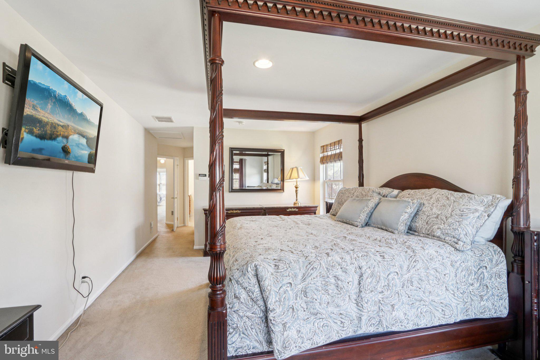 24 Compass Circle Mount Laurel, NJ 08054 - Photo 32 of 61 a bedroom with a large bed and a painting on the wall