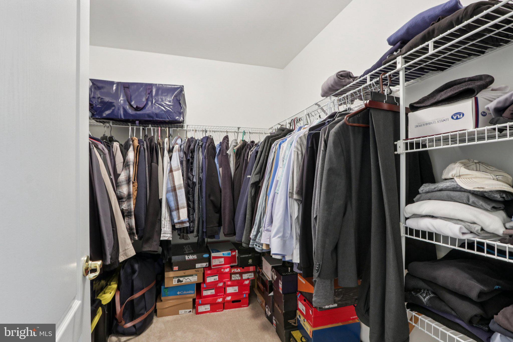 24 Compass Circle Mount Laurel, NJ 08054 - Photo 37 of 61 a view of walk in closet with clothes and shoes