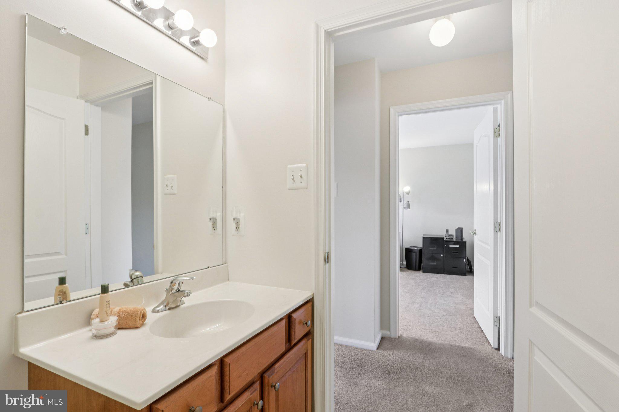 24 Compass Circle Mount Laurel, NJ 08054 - Photo 43 of 61 a en suite bathroom with a sink and a mirror