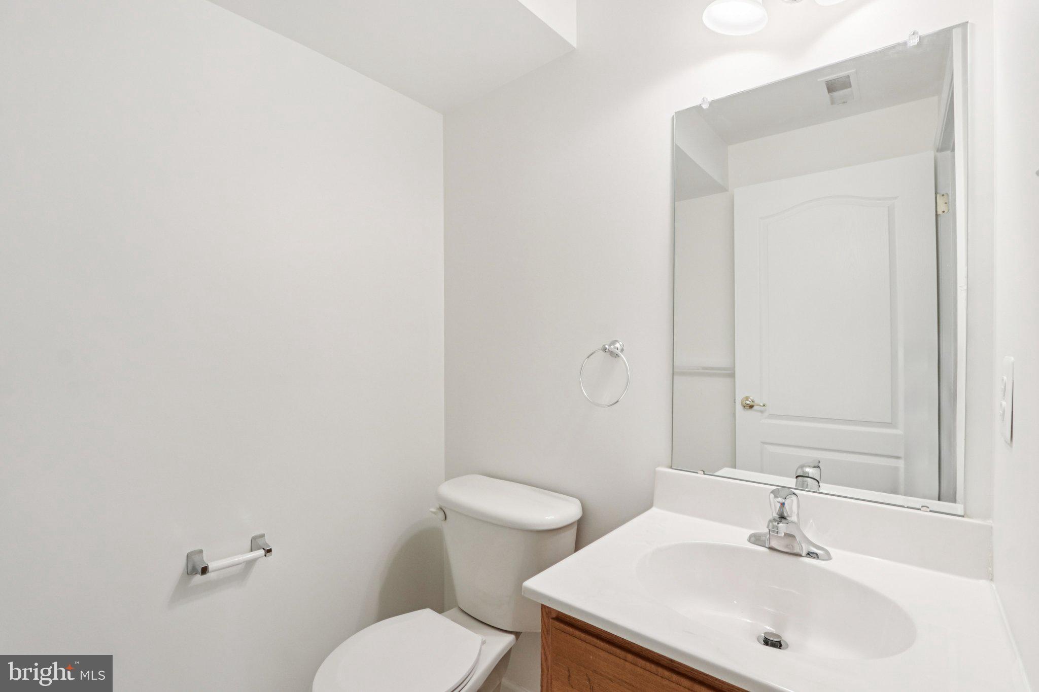 24 Compass Circle Mount Laurel, NJ 08054 - Photo 49 of 61 a bathroom with a sink a toilet and a mirror