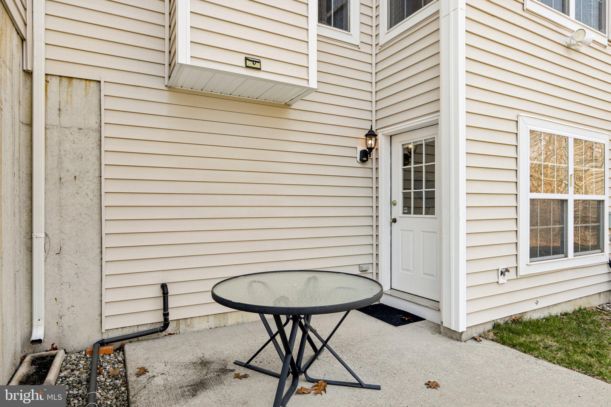 24 Compass Circle Mount Laurel, NJ 08054 - Photo 50 of 61 a view of a porch with a table and chairs and a potted plant