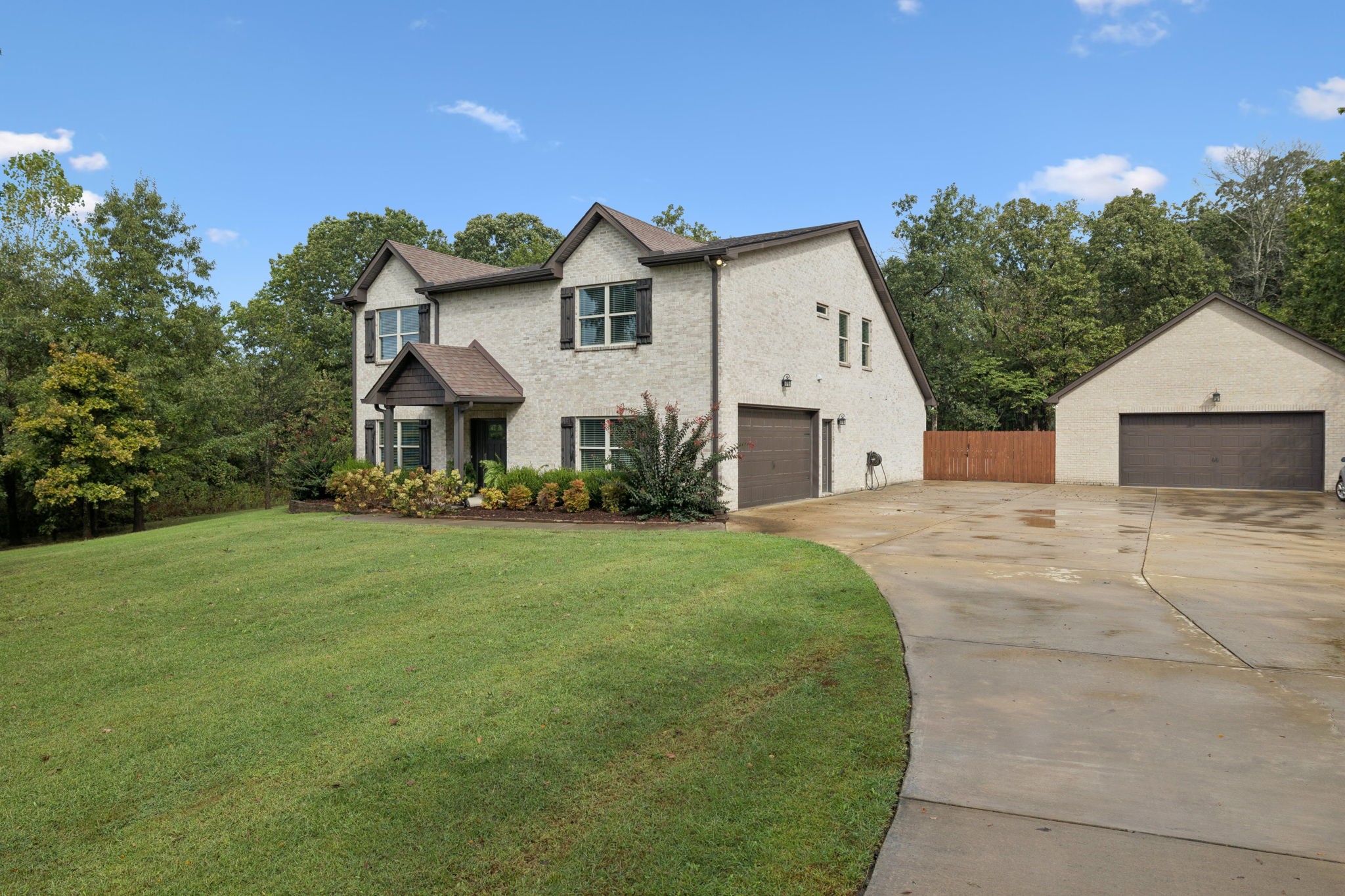1964 Harkreader Road Mount Juliet, TN 37122 - Photo 5 of 80 a view of a white house next to a yard with big trees