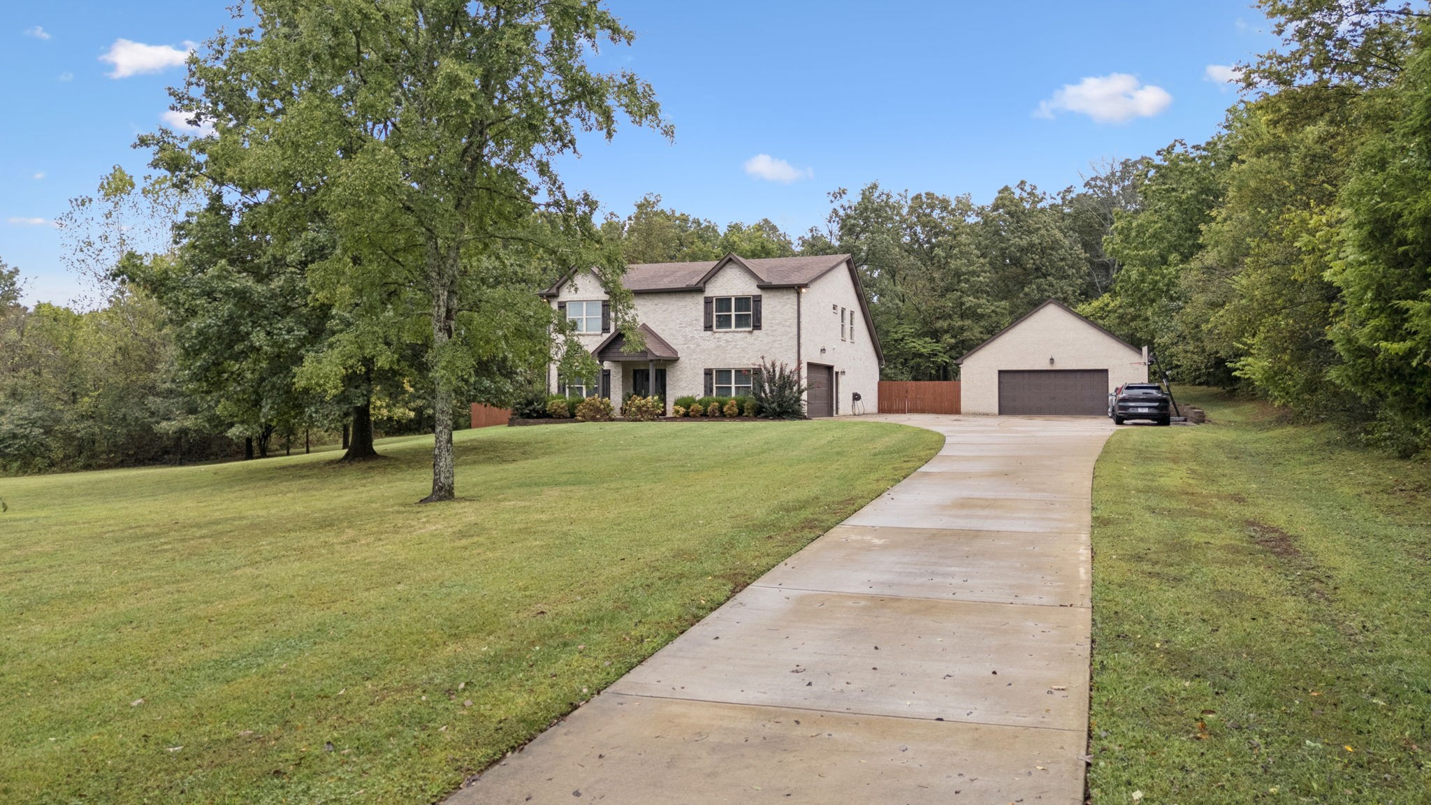 1964 Harkreader Road Mount Juliet, TN 37122 - Photo 6 of 80 a front view of a house with a yard and trees