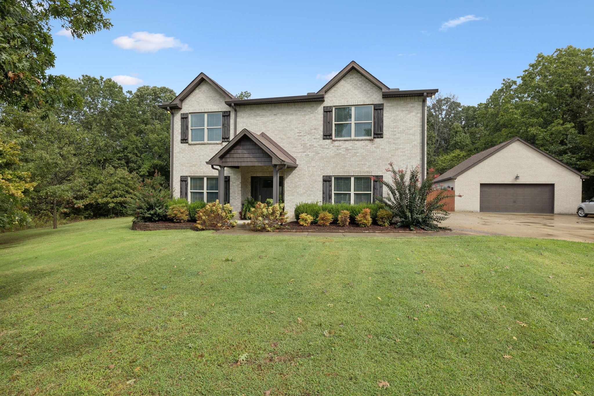 1964 Harkreader Road Mount Juliet, TN 37122 - Photo 7 of 80 a front view of a house with a yard and trees