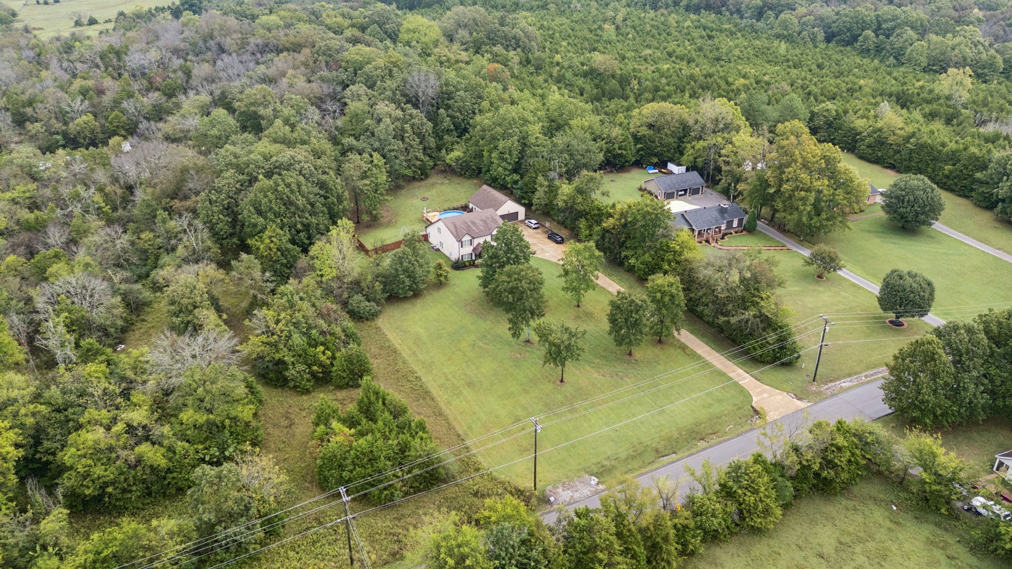1964 Harkreader Road Mount Juliet, TN 37122 - Photo 72 of 80 an aerial view of residential houses with outdoor space and trees