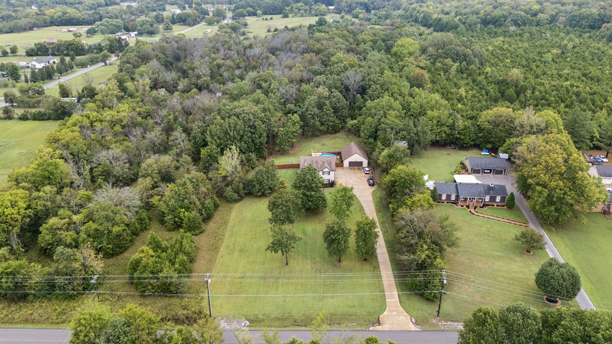 1964 Harkreader Road Mount Juliet, TN 37122 - Photo 73 of 80 an aerial view of residential houses with outdoor space and trees