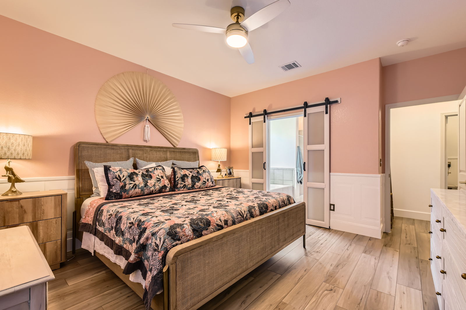 261 Mendoza Kyle, TX 78640 - Photo 15 of 28 a bedroom with a large bed and a chandelier