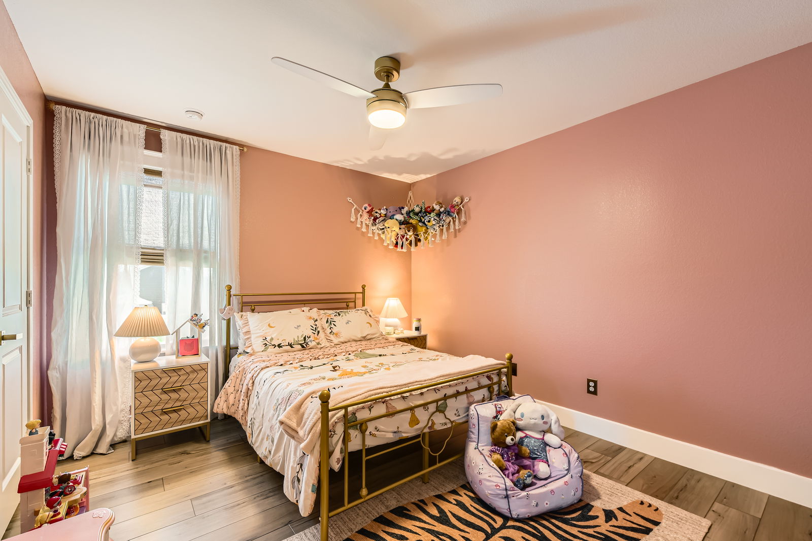 261 Mendoza Kyle, TX 78640 - Photo 22 of 28 a bedroom with a bed and a chandelier