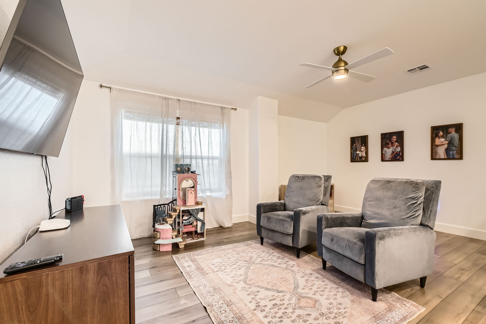 261 Mendoza Kyle, TX 78640 - Photo 24 of 28 a living room with furniture and a large window