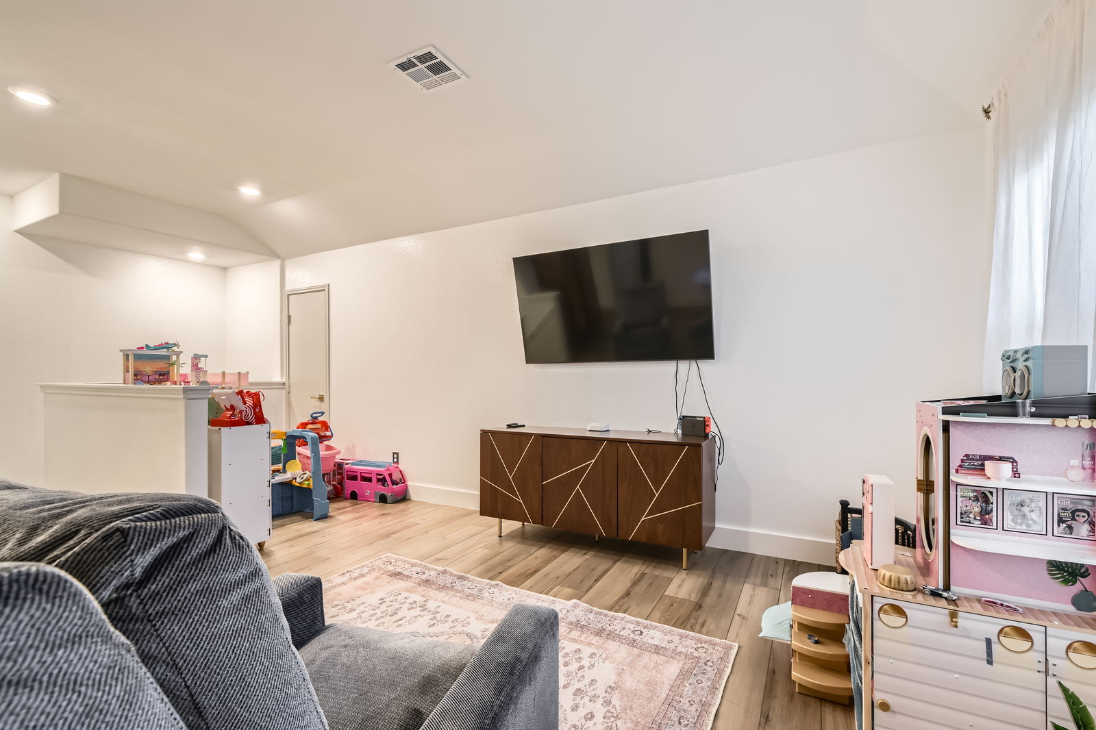 261 Mendoza Kyle, TX 78640 - Photo 25 of 28 a living room with furniture and a flat screen tv