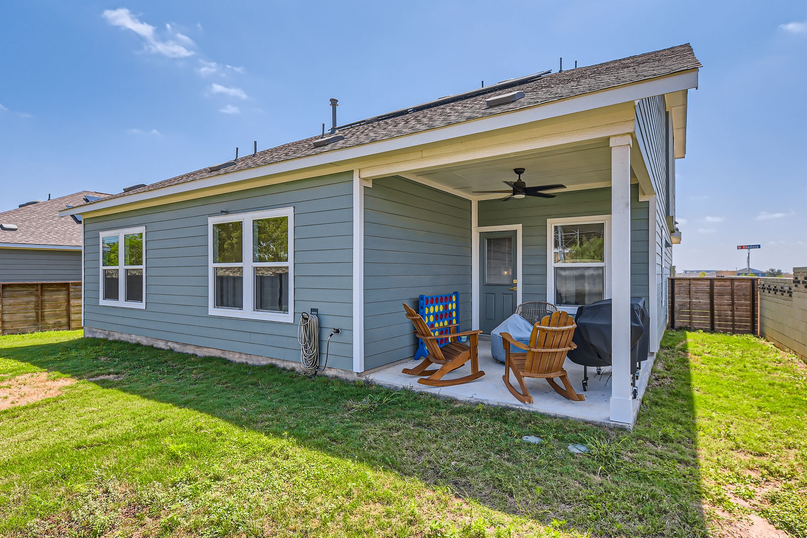 261 Mendoza Kyle, TX 78640 - Photo 26 of 28 a view of an house with backyard porch and furniture