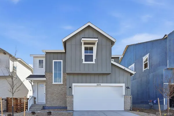 a front view of a house with garage