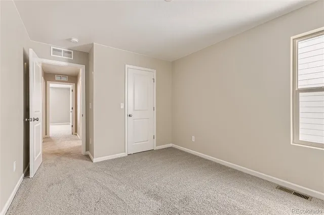 a bathroom with a bathtub shower sink vanity and toilet