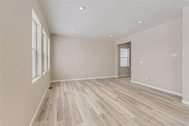 a kitchen with granite countertop a stove top oven sink and cabinets