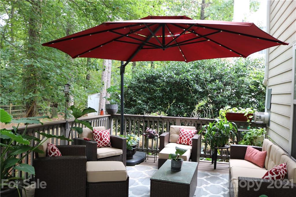 6414 Nevin Road Charlotte, NC 28262 - Photo 2 of 17 a view of balcony with furniture and umbrella