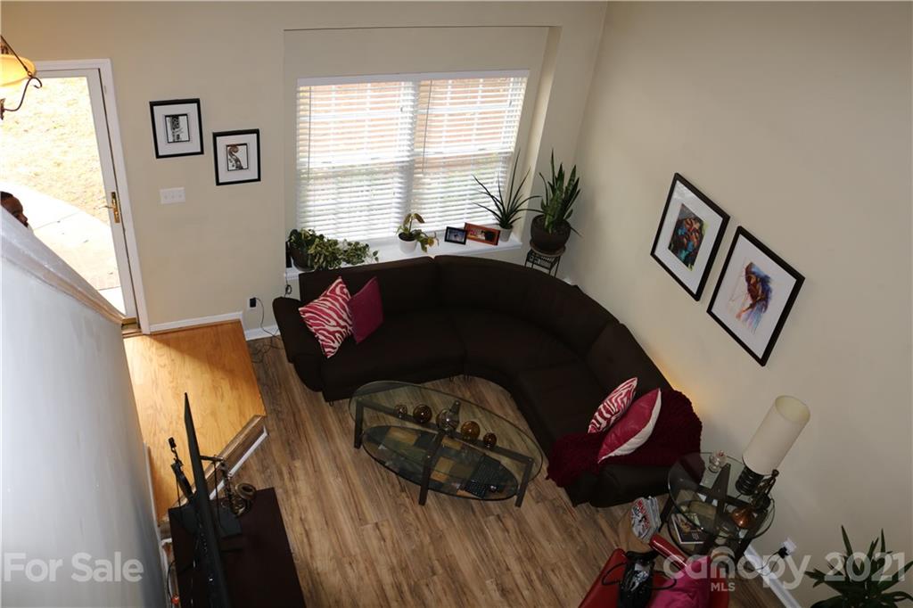 6414 Nevin Road Charlotte, NC 28262 - Photo 5 of 17 a bedroom with a bed and a painting on the wall