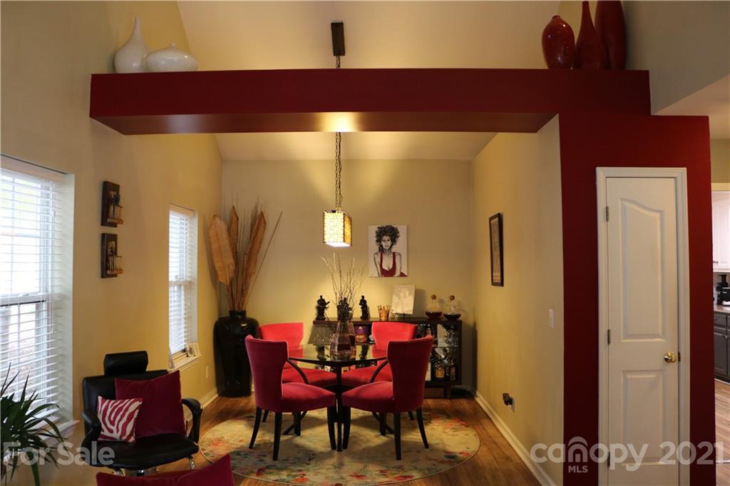 6414 Nevin Road Charlotte, NC 28262 - Photo 7 of 17 a view of a dining room with furniture and chandelier