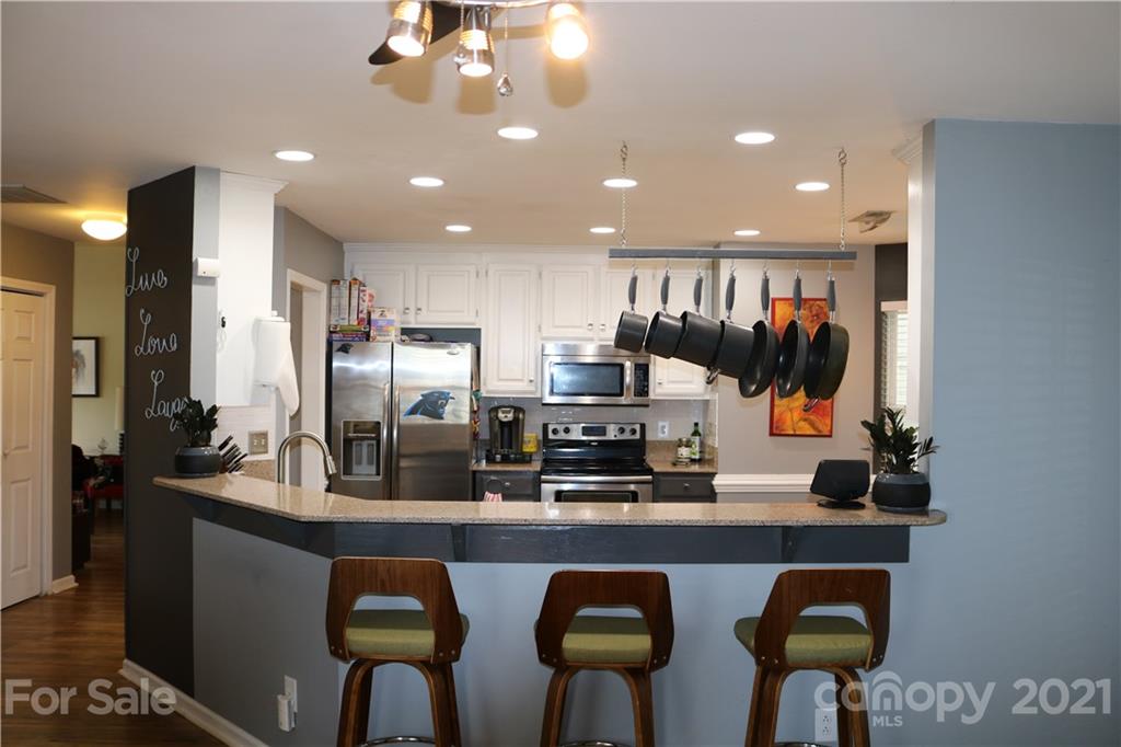 6414 Nevin Road Charlotte, NC 28262 - Photo 8 of 17 a kitchen with lots of counter space and appliances