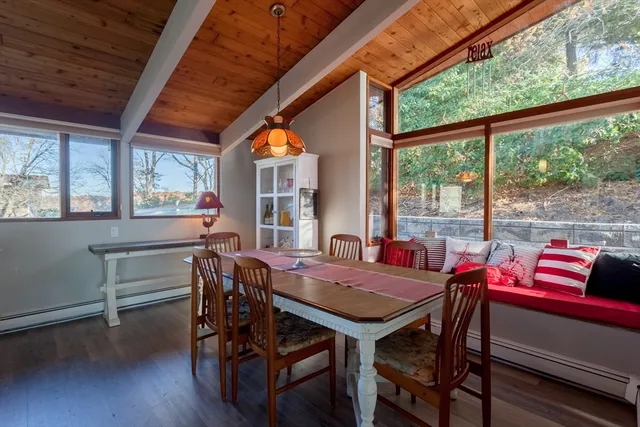 a view of a dining room with furniture window and outside view