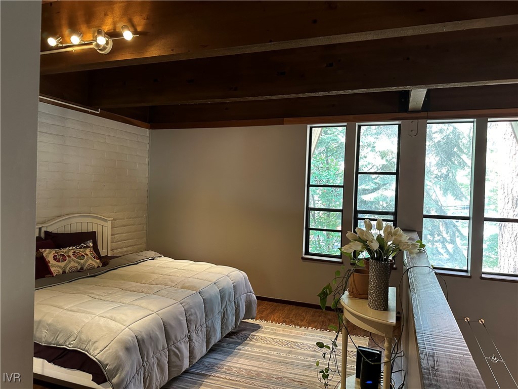 120 Country Club Drive, Unit 2 Incline Village, NV 89451 - Photo 14 of 24 a bedroom with a bed and wooden floor