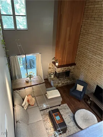 a living room with chairs and a table
