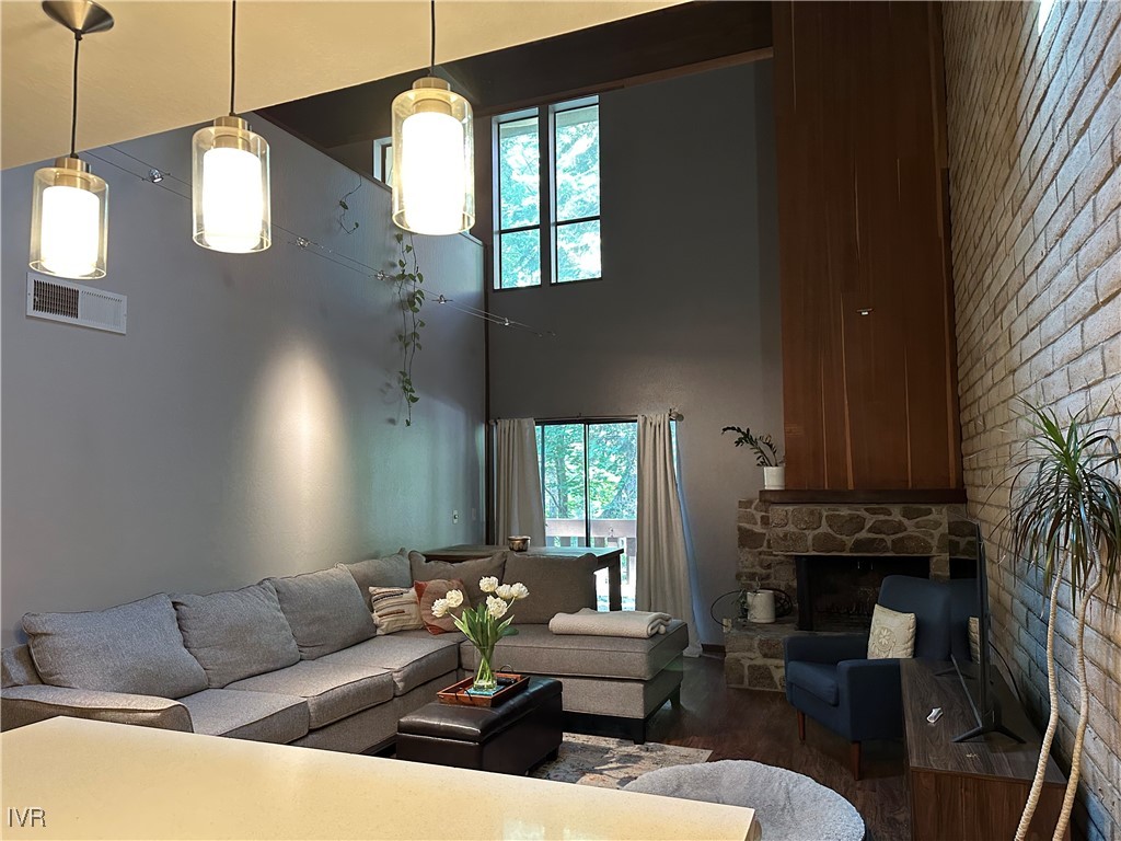 120 Country Club Drive, Unit 2 Incline Village, NV 89451 - Photo 8 of 24 a living room with furniture a fireplace and a large window