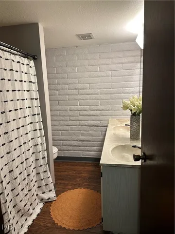 a bathroom with a sink and a shower