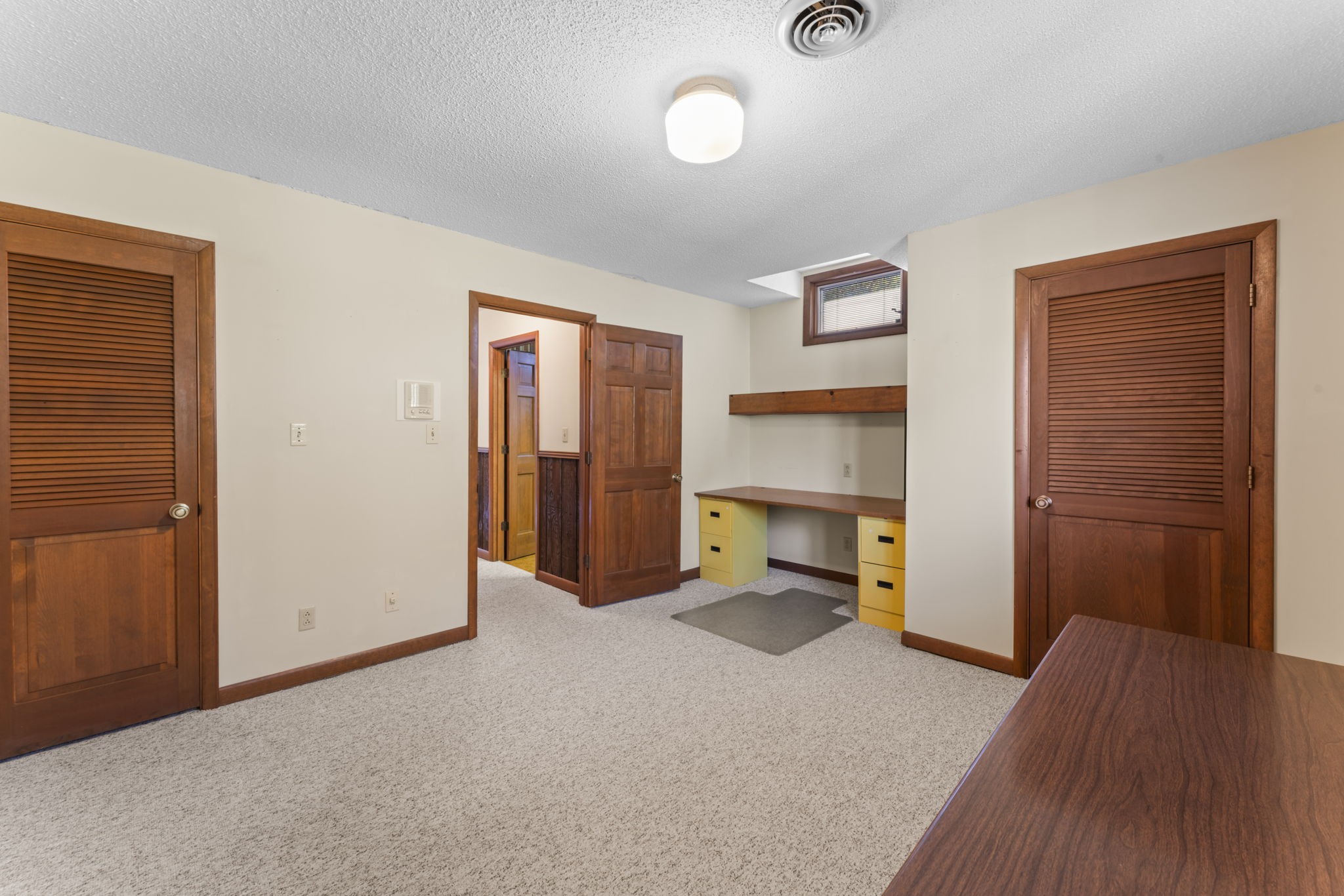 171 George Hill Road Manchester, TN 37355 - Photo 54 of 70 an empty room with a fireplace and wooden floor