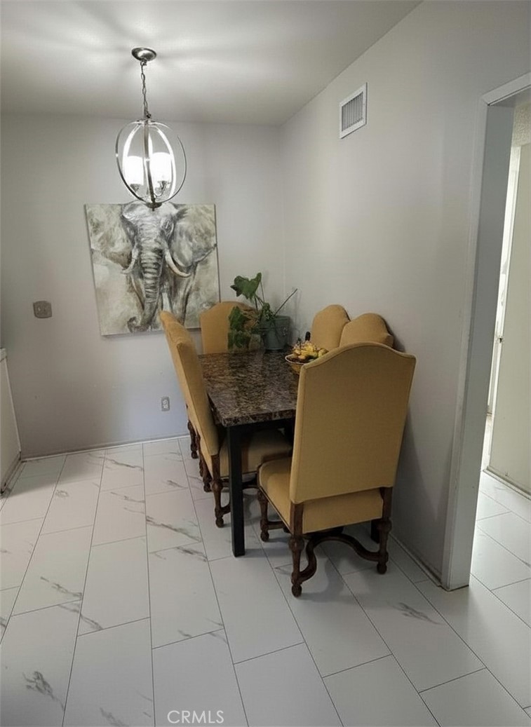 31732 Ridge Rte Road, Unit 211 Castaic, CA 91384 - Photo 6 of 9 a view of a room with furniture and chandelier