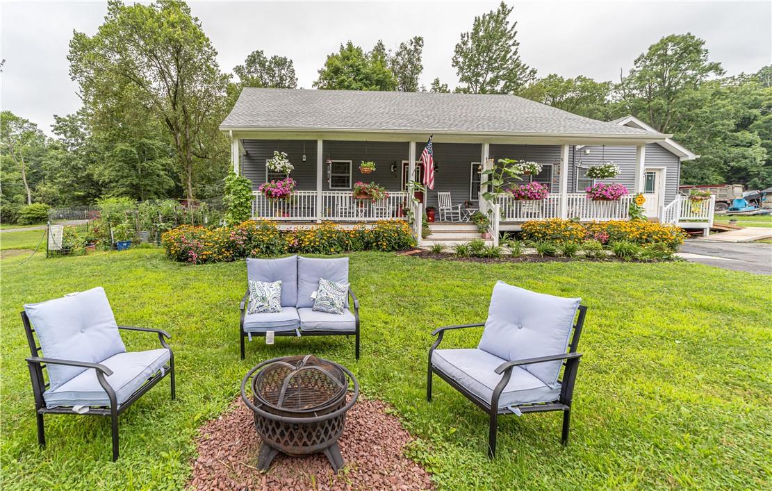a front view of a house with garden