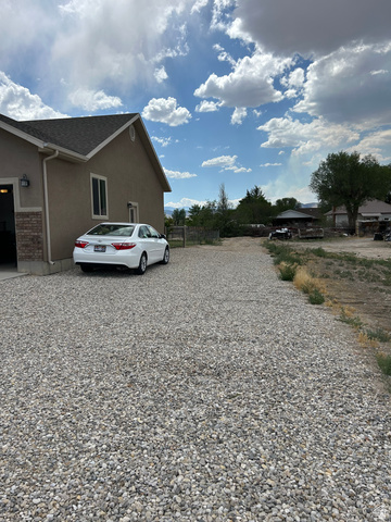 175 North 100th West Centerfield, UT 84622 - Photo 3 of 32 Gravel driveway offering extensive parking capacity. Possible RV Parking