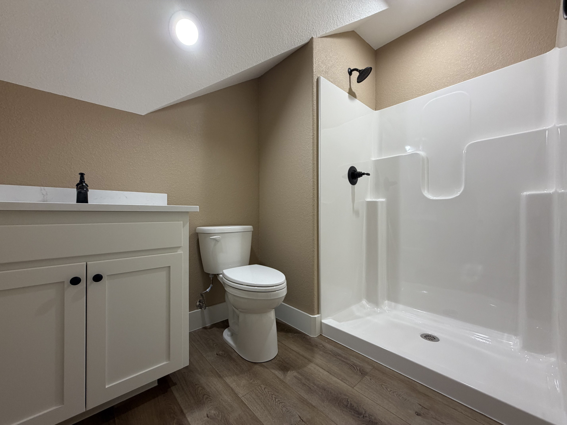 33 Wilderness Road North Calera, OK 74730 - Photo 26 of 39 Vanity with white shaker cabinetry, white countertop, and dark hardware