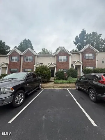 a car parked in front of a house