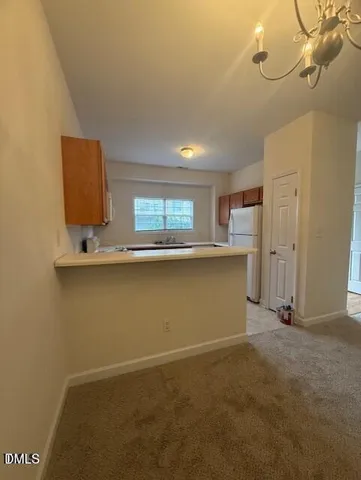 a view of kitchen with cabinets