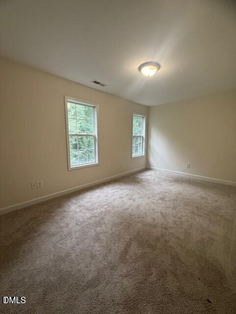 4622 Centrebrook Circle Raleigh, NC 27616 - Photo 8 of 14 an empty room with windows